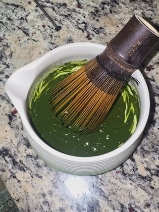 Sifting and whisking the morning's ceremonial matcha